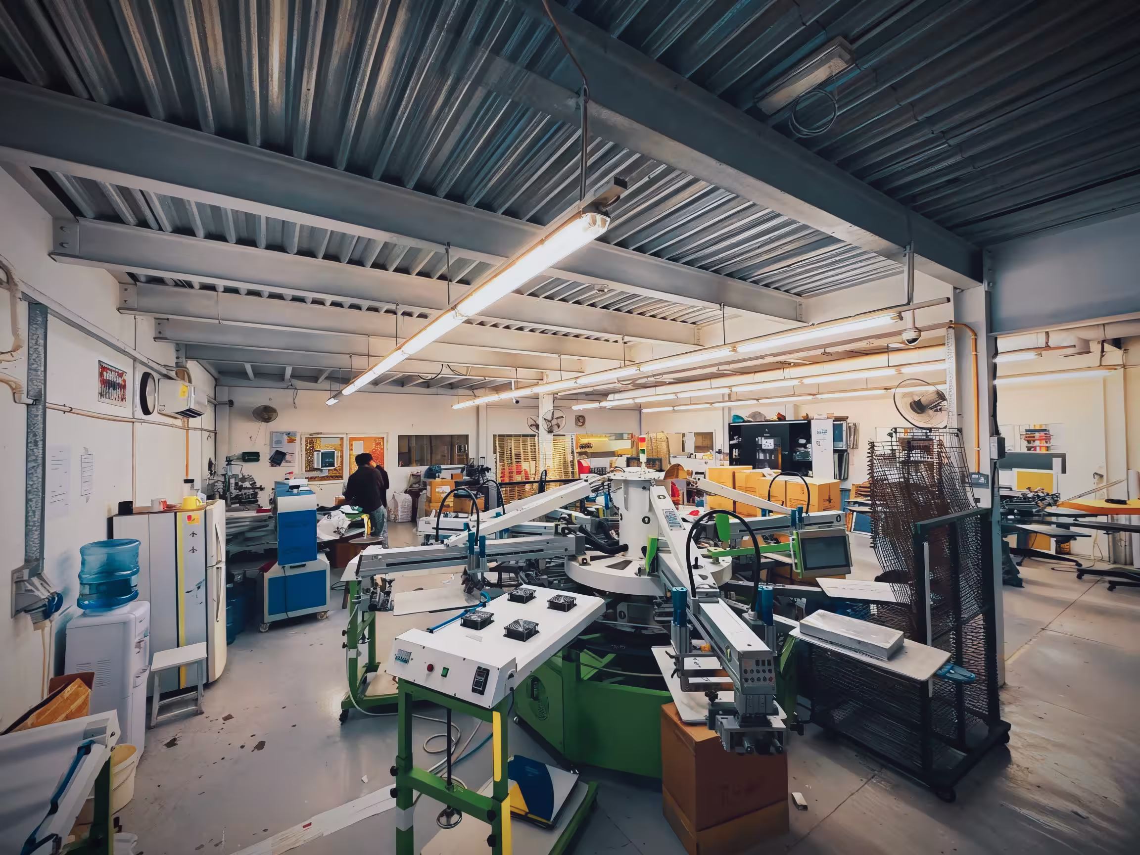 Wide-format printing production floor with industrial printers and finishing equipment