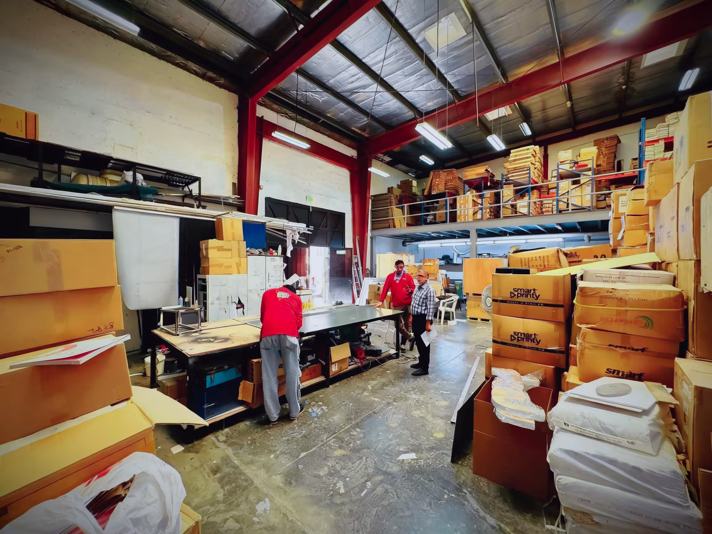 Industrial printing facility interior with production machinery and workflow stations