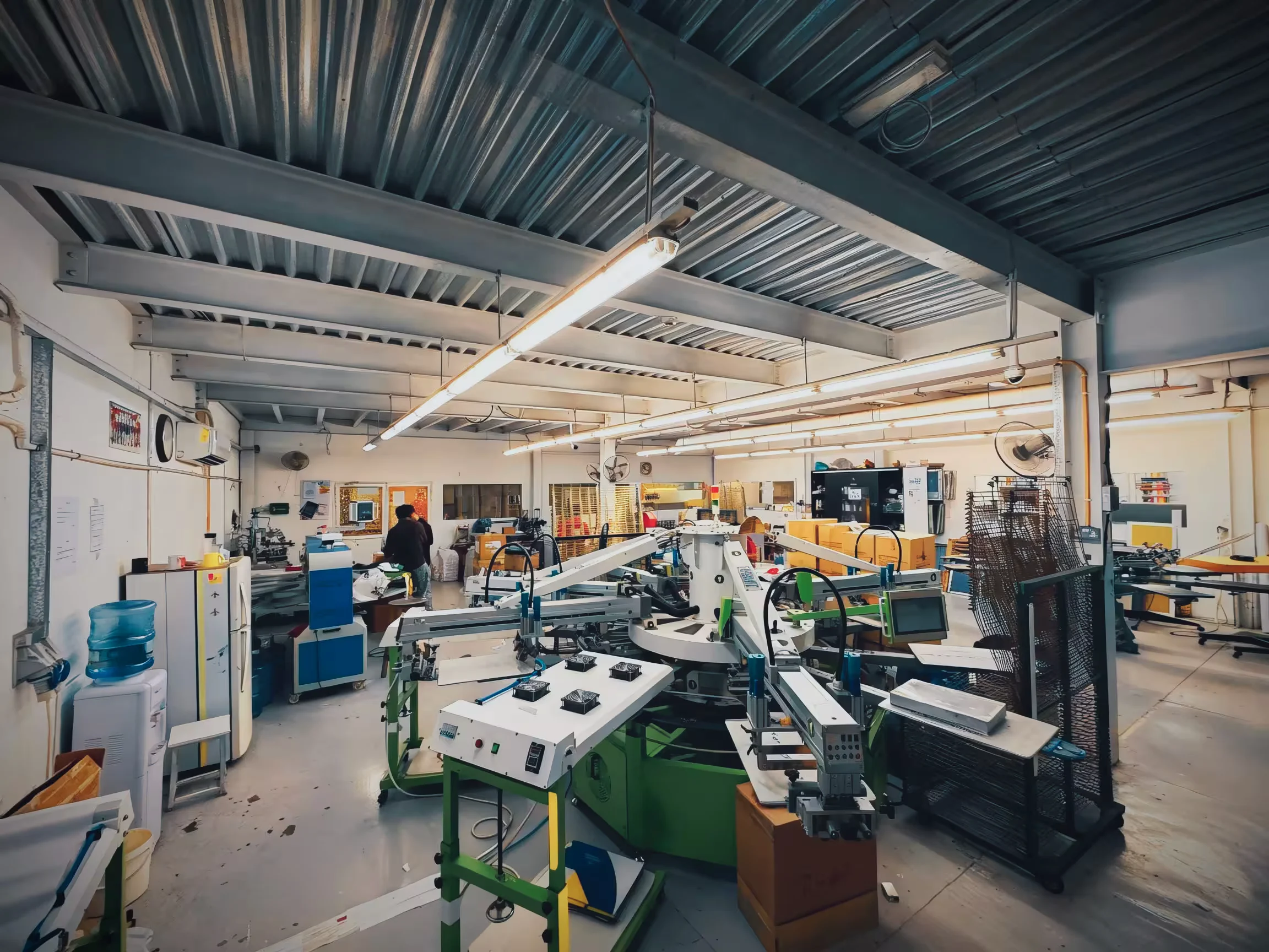 Wide-format printing production floor with industrial printers and finishing equipment