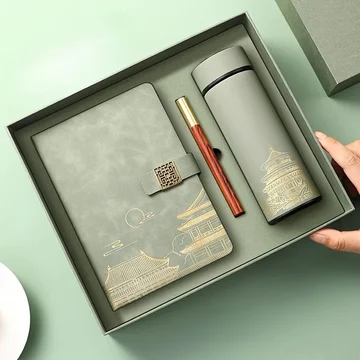Impress every recipient. Premium gift set with leather notebook, pen, and tumbler